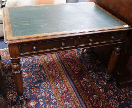 A Victorian mahogany two drawer writing table, W.3ft 6in.